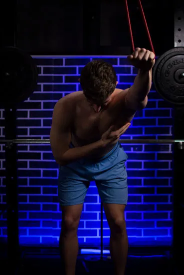 Lat stretching with rubber band pectus