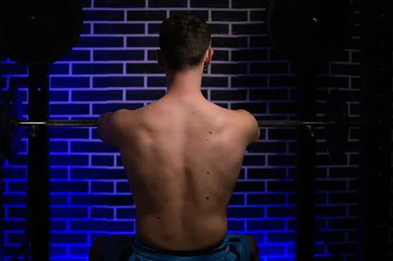 Shoulders back and down before pressing